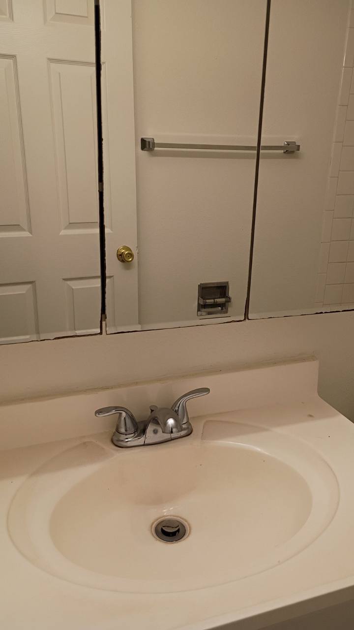 Clean bathroom sink with mirror